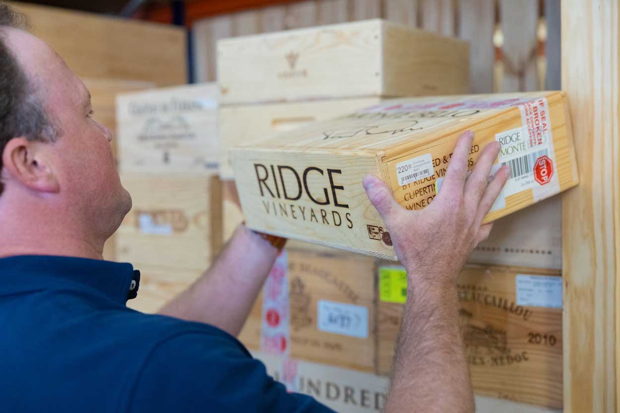 Putting wine box in the storage unit